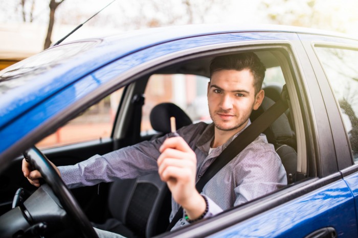 Driving Hub - Car driving - Boy driving a car - inexpensive driving schools